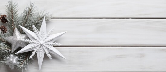 Top view or flat lay photo of a Christmas decoration placed on a white wooden board with copy space image available