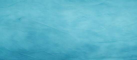 Obraz premium A copy space image of a textured background in a light blue cyan shade perfect for graphic design purposes