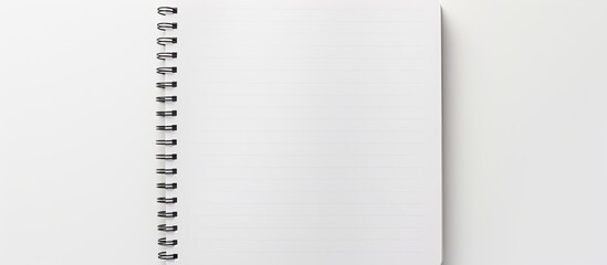 A copy space image of a blank paper notebook or notepad on a white background