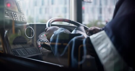 Hands, bus and driver of public transportation as city service for passengers downtown, metro or journey. Person, steering wheel and vehicle for morning commute in Boston or traveling, traffic or job