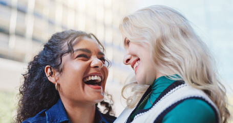 Happy, woman and friends laughing outside in city together, bonding and relationship with diversity...