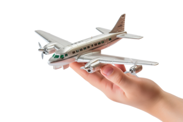 Dreams Take Flight: A Hand Embracing the Sky With a Toy Plane on White or PNG Transparent Background.