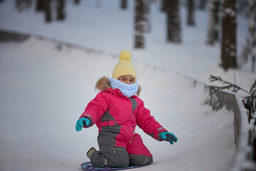 Snowfalls Whisper, A Tiny Daredevil Shreds a Snowy Mountainside on Her Snowboard