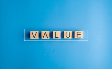 Wooden cube with word value added. Profit, benefit growth and development in business