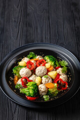 chicken meatball soup with vegetables in a bowl