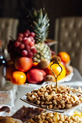 A large variety of fruits and vegetables on the table for guests