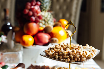 A large variety of fruits and vegetables on the table for guests