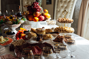A large variety of fruits and vegetables on the table for guests