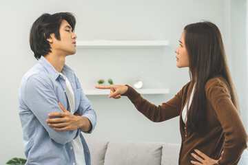 Asian young couple fight standing on white background, relationship in trouble. Different angry,...