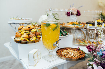 A wide variety of snacks on the table for guests. Shrimp, boiled pork, various types of meat and other products