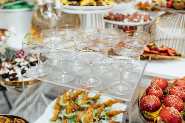 A wide variety of snacks on the table for guests. Shrimp, boiled pork, various types of meat and other products
