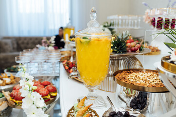 A wide variety of snacks on the table for guests. Shrimp, boiled pork, various types of meat and other products