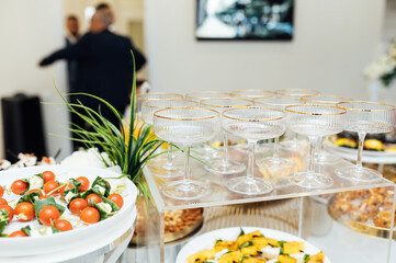 A wide variety of snacks on the table for guests. Shrimp, boiled pork, various types of meat and other products