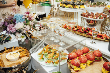 A wide variety of snacks on the table for guests. Shrimp, boiled pork, various types of meat and other products