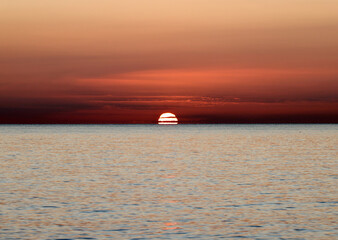 Sunrise over the Mediterranean Sea seen from the beach in Torremolinos. Costa del Sol, Spain