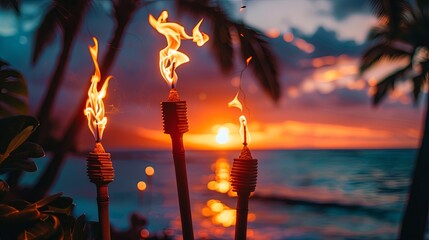 Hawaii sunset with fire torches. Hawaiian icon lights burning at dusk at beach resort or restaurants for outdoor lighting and decoration cozy atmosphere