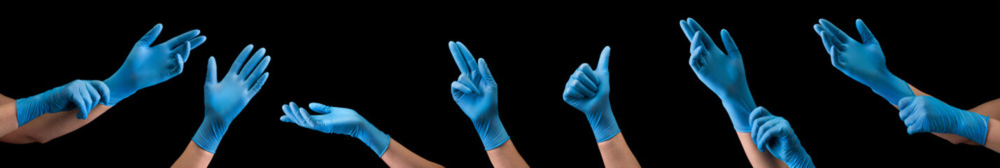 Doctor's hand in sterile medical gloves showing gesture or something on black