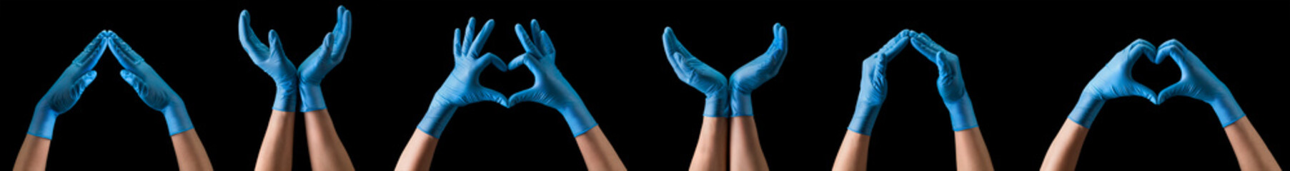 Doctor's hand in sterile medical gloves showing gesture or something on black