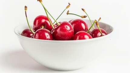 Fresh cherry berries in a bowl on a white background. The concept of a healthy diet and support for local producers. Close-up.