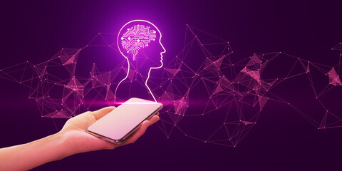 Close up of female hand holding mobile phone with polygonal head outline with brain on purple...