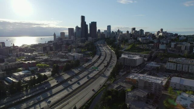 Drone following traffic on interstate 90 toward downtown Seattle, in sunny USA
