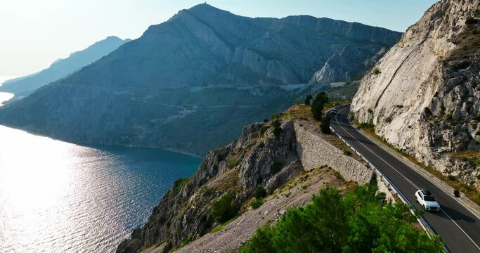 Cars on route D8 in the mountains of the Makarska riviera, Croatia - Aerial view