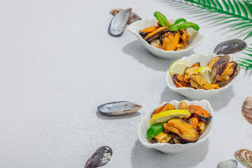 Mussels with oil, spices and greens. Healthy seafood is rich in omega. Marine decor