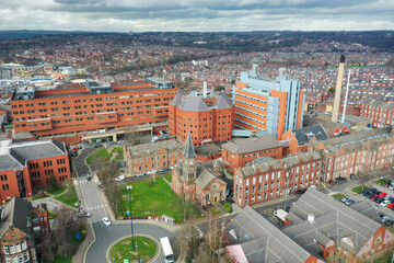 Obraz premium Aerial photo take in the town of Harehills in Leeds just outside the city centre, showing the St James's University Hospital known as Jimmy's with traffic and ambulances parked up at A and E entrance