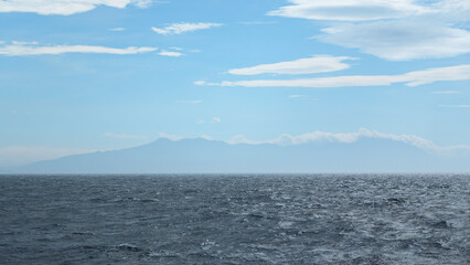 Beautiful seascape from water to mountain on horizon. Clip. View from floating boat to sea horizon...