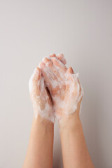The habit of washing hands thoroughly with soap and foam for hygiene purposes.