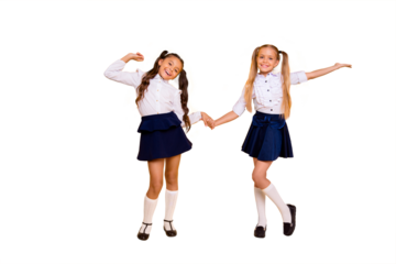 Back to school concept. Full length, legs, body, size portrait of  small girls happily jump holding hands isolated on bright yellow background