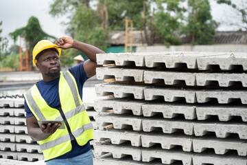 Portrait African engineer man working at precast cement outdoor factory	