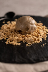 A ball of peanut halva-flavored ice cream