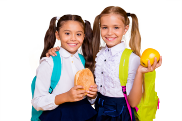 Concept of nutrition in school. Two cute, nice-looking, lovely, sweet small girls isolated on vivid yellow background hold snack in hands hugging each other