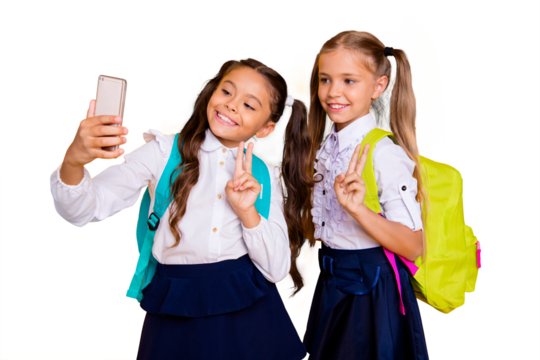 Profile side view photo of two small girls make selfie on smartphone camera showing v-sign isolated on shine yellow background