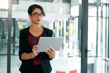 Obraz premium Business woman, social media app and tablet for typing, office and communication. Employee, person scrolling on work website and networking, searching and technology or internet browsing online