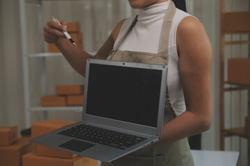 Portrait of young business asian woman online working in office desk use computer copyspace. Success business people employee, freelance SME online marketing work at home, coworking space concept