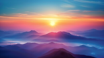 Amazing mountain landscape with vibrant colors. The setting sun casts a pink and purple glow on the peaks and clouds.
