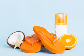 Top view composition of flip flops placed with beach accessories perspective view on table...