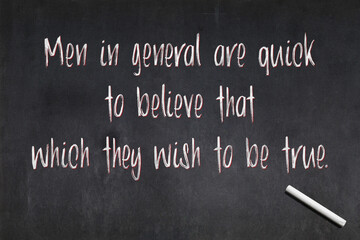 Fototapeta premium Quote from Julius Caesar about confirmation bias written on a blackboard