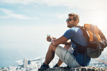 Man, thinking and view with backpack on rock with thoughts, relax and serenity on adventure for solitude in nature. Person, hiking and cellphone on cliff with mock up, peace and calm sustainability.