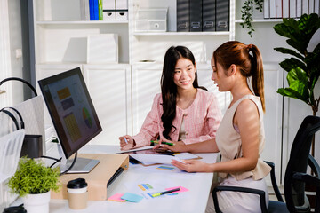 The young group of Asian attractive businesswomen adviser in casual sitting and discussing during the meeting on working table at office. Professional business adviser. Businesswomen in a meeting.