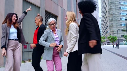 group of corporate successful women with their leader or boss of the office building dance happy for their success. outdoor