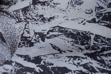 Top view of white and dark blue fabric with abstract print