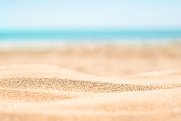 Sandy beach with horizon blue sea and sky background