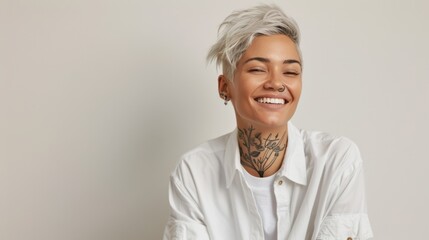 The smiling tattooed person