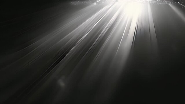 Rays of light occasionally break through the darkness offering brief moments of clarity before disappearing once again.