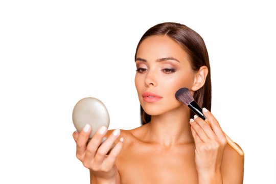Half turn portrait of brunette hair good-looking lovely charming pretty lady with her naked shoulders she use brush to repair make up isolated on pastel beige background