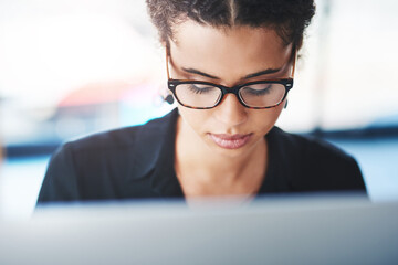 Businesswoman, computer and read with glasses and face, close up and online work for seo...