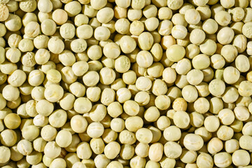 Background of a green peas grains close up. Food pattern.